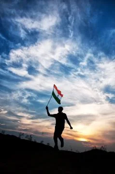 Man jumping with indian flag Stock Photos