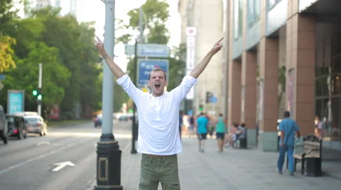 Man jumping for joy in the streets. overjoyed. Stock Footage 66112281