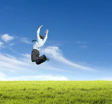Man jumping on  meadow Stock Photos