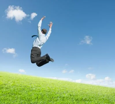 Man jumping on  meadow Photos
