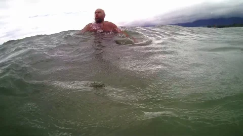 Man jumping into ocean. Stock Footage 99813971