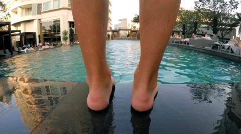 Man Jumping into Open-Air Pool and Swim Stock Footage 61348849