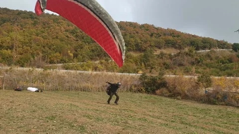 Man Jumping With Parachute 스톡 동영상 144695563