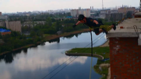 Man jumping from the parapet of flats Stock Footage 38187140