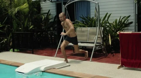 Man jumping in the pool Stock Footage 48489401