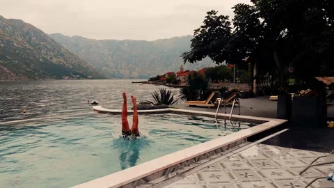 Man jumping into the pool Stock Footage 231807161