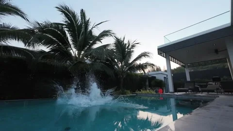 A man jumping into the pool Stock Footage 310683787