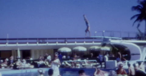 Man Jumping in Pool Hotel Miami 60s 16mm Video stock 46970068