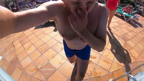 Man jumping into the pool in slow motion 250fps Stock Footage 125303137