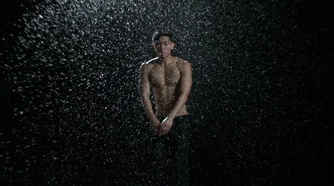 Man jumping in rain Stock Footage 47523162