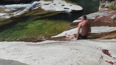 Man jumping into river Video stock 114177337