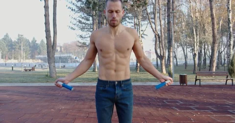 Man jumping rope in the park Stock Footage 121715114