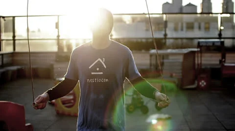 Man Jumping Rope Working Out with Jumprope on Rooftop Sunrise Fitness Exercise Stock-Footage 24685742