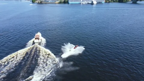 Man jumping on the see waves on a water scooter. Extreme sport leisure at summer Stock-Footage 156444310