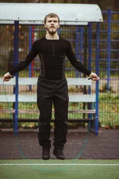 Man jumping with skipping rope Stock Photos
