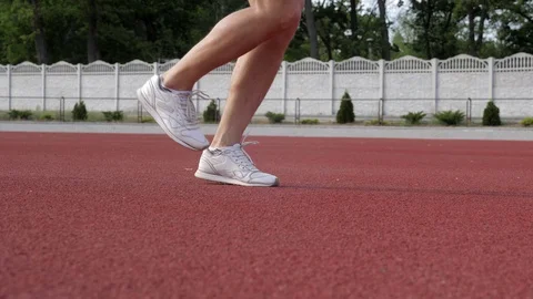 A man jumping with skipping rope on a track Stock Footage 130138586