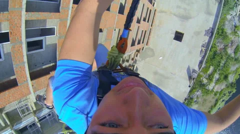 Man jumping from a skyscraper headfirst Stock Footage 38187335