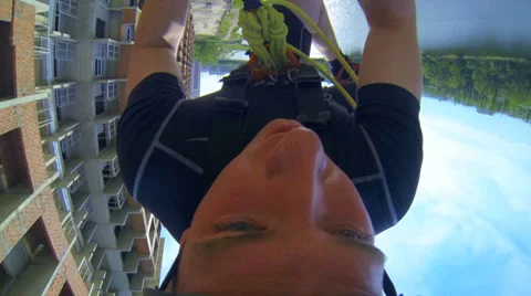 Man jumping from a skyscraper headfirst Stock Footage 38187757