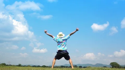 A man jumping slow motion and cloud sky background. Stock Footage 108083290