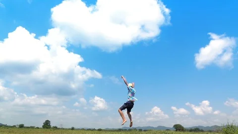 A man jumping slow motion and cloud sky background. Stock Footage 108083362