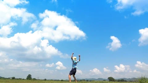 A man jumping slow motion and cloud sky background. Stock Footage 108083406