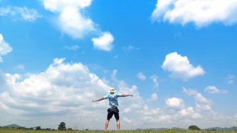 A man jumping slow motion and cloud sky background. Stock Footage 108083471