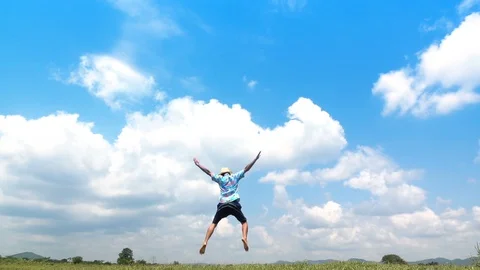 A man jumping slow motion and cloud sky background. Stock Footage 108084984