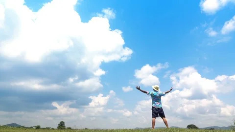 A man jumping slow motion and cloud sky background. Stock Footage 108084993