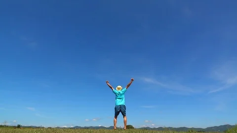 A man jumping slow motion and cloud sky background. Stock Footage 108777366