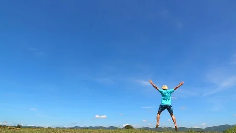 A man jumping slow motion and cloud sky background. Stock Footage 108778666