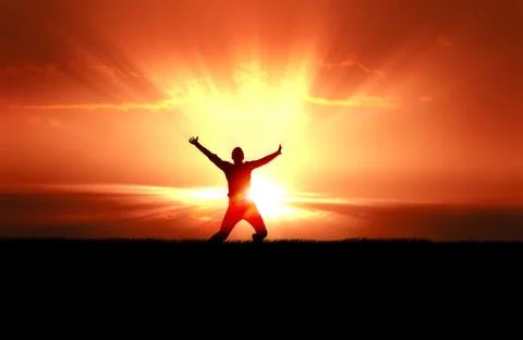 Man Jumping in Sun Rays Stock Photos