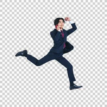 A man jumping while calling with a smartphone. Foto stock
