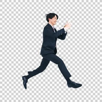 A man jumping while using a smartphone. Foto stock