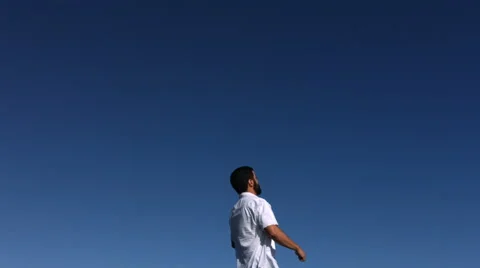 Man jumps and falls on back, slow motion Stockbeeldmateriaal 61670324