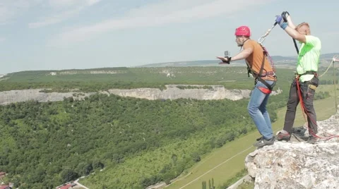  A man jumps from a cliff Stock Footage 54108910