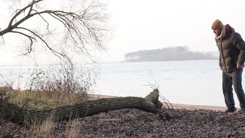 A man jumps over a fallen tree 스톡 동영상 144214137