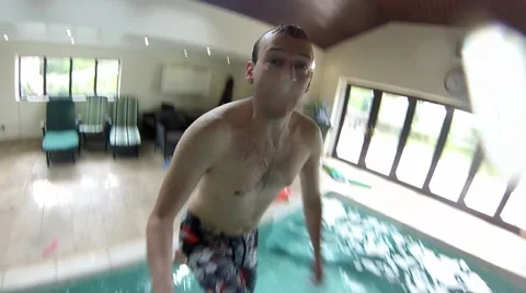 Man Jumps into swimming pool Stock Footage 46726381
