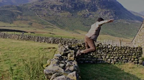 Man jumps wall in slow motion Stock Footage 41945112