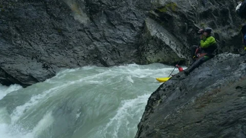 A man in a kayak drops down a small wa Stock Footage 139040568