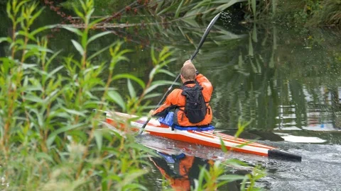 Man kayaking on a calm river Stock Footage 100246513