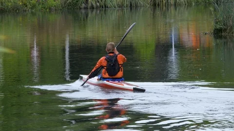 Man kayaking on a calm river Stock Footage 100256055