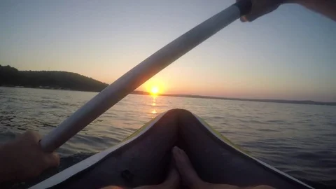 Man kayaking at sunset Stock Footage 82391654