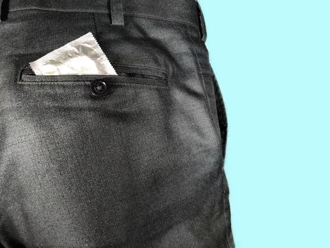 Man keep Condom packet in back pocket of pant , sex protection contraceptive Stock Photos
