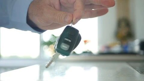 Man Keep in Hand Car Key with Remote Control Showing to the Camera Stock Footage 114324242