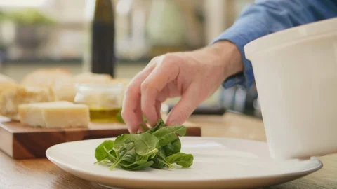 Man Keeping Fresh Spinach In Plate At Kitchen Stock Footage 86078079