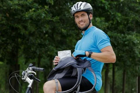 Man keeping map in bag Stock Photos