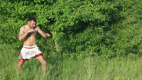 Man Kickboxer exercising kicks Stock Footage 77251717