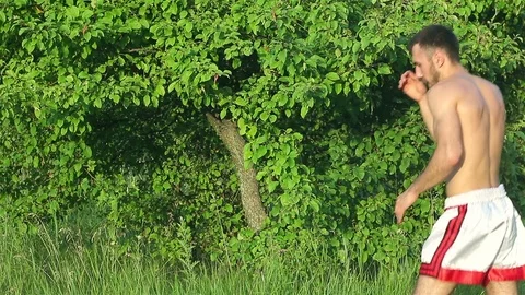 Man Kickboxer exercising kicks Stock Footage 77264302