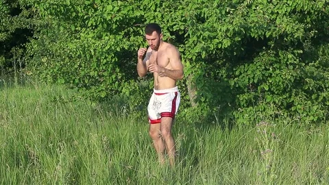 Man Kickboxer exercising kicks Stock Footage 77266301