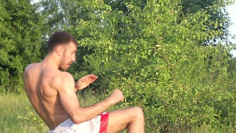 Man Kickboxer exercising kicks Stock-Footage 77266574